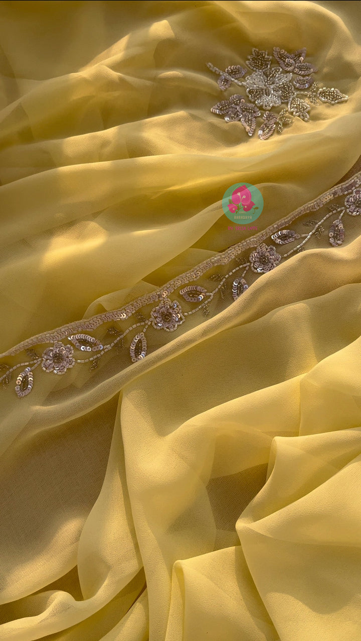 Soft Yellow viscous georgette saree with beautiful hand embroidery