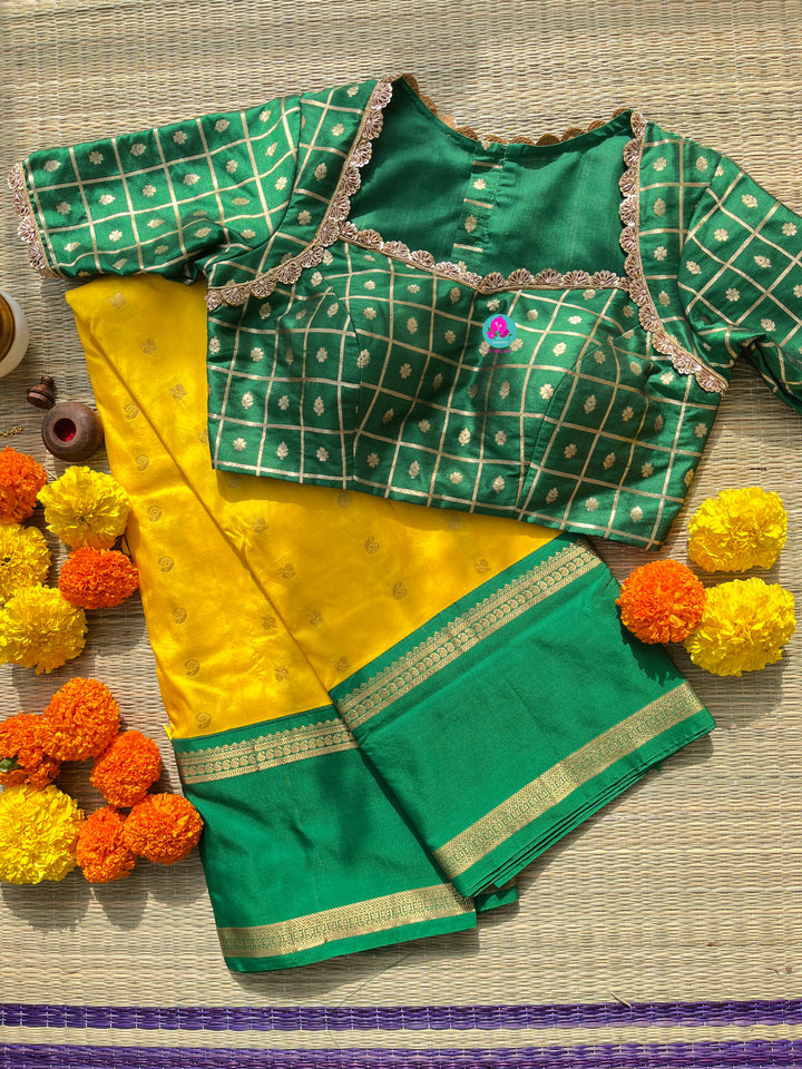 Yellow saree with green border